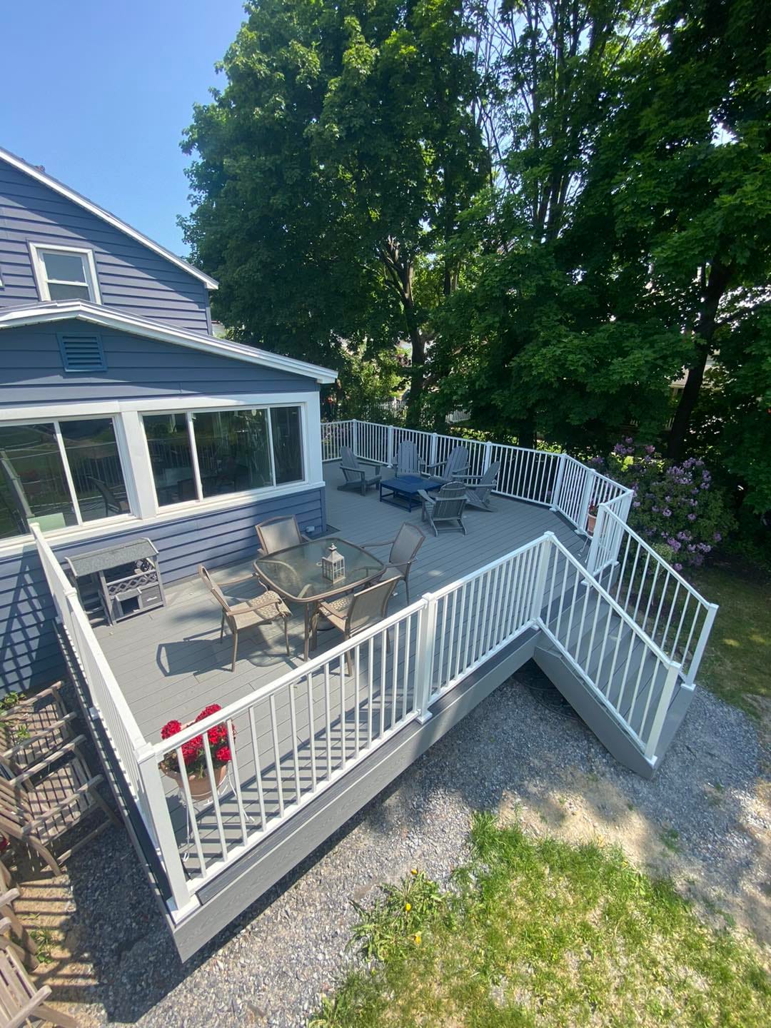 Custom deck and sunroom outdoor living space by Medial Construction Services