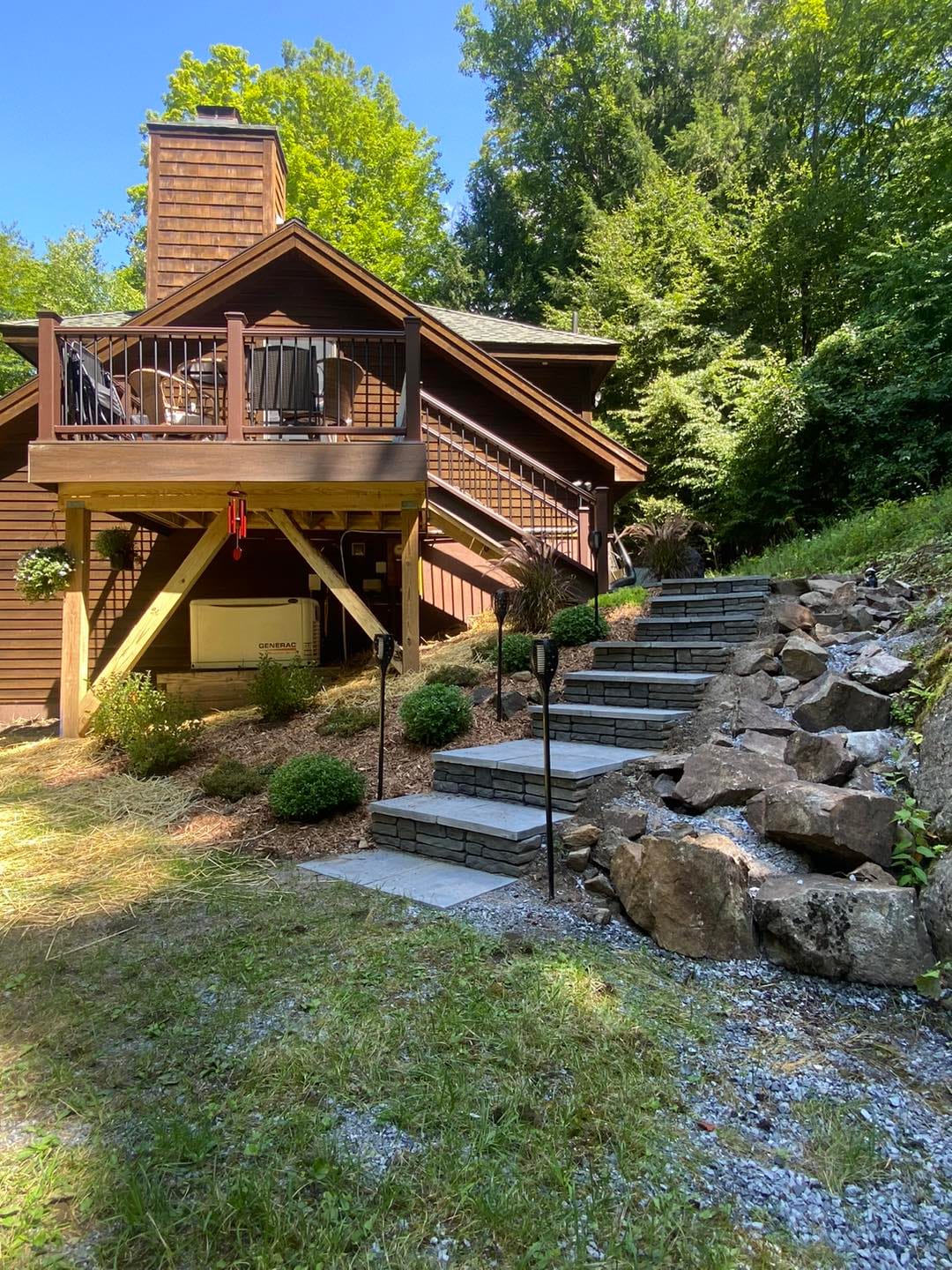 Deck and outdoor living space by Medial Construction Services